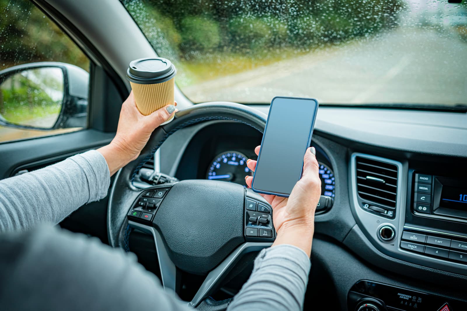 Distracted Driver on Cell Phone, drinking Coffee